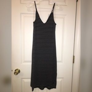 Black thin strap dress w/ white stripes.